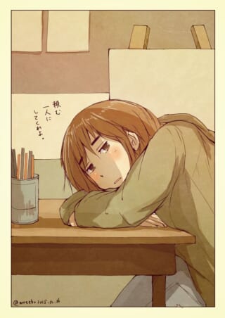 机に突っ伏して憂鬱そうな女性のイラスト