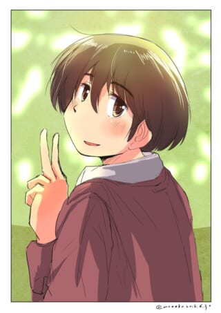 ピースサインをして微笑むマキタ